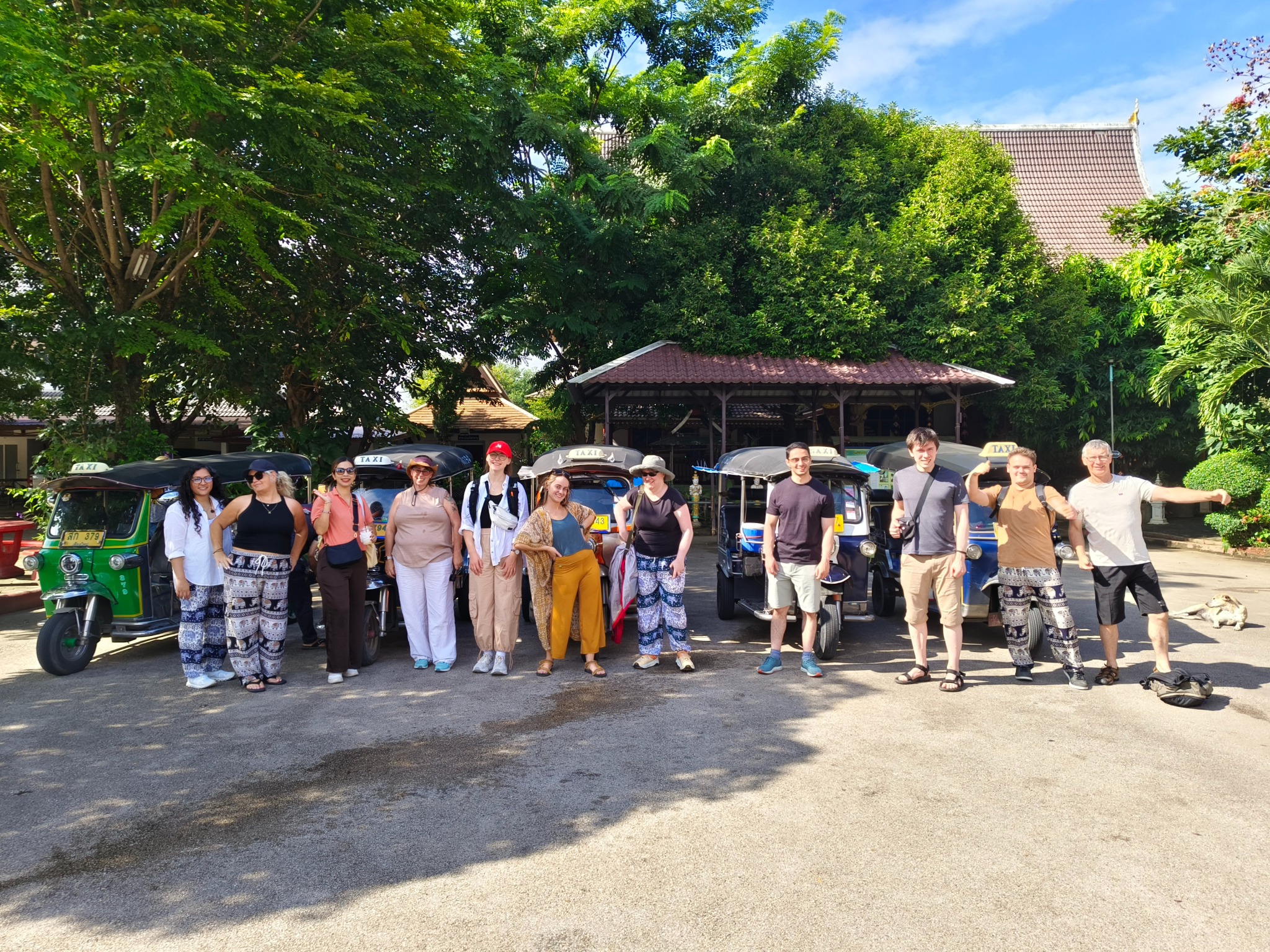 Guests riding a tuk-tuk